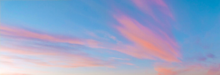 Sky background with pink clouds at sunset. For print and graphic resources.