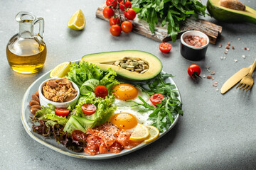 Ketogenic diet breakfast vegetables salad, avocado, fish, eggs, nuts with bulletproof keto coffee. place for text, top view