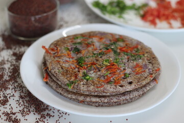 Finger millet or Ragi uthappam. Healthy pan cake made of fermented batter of finger millet and lentils