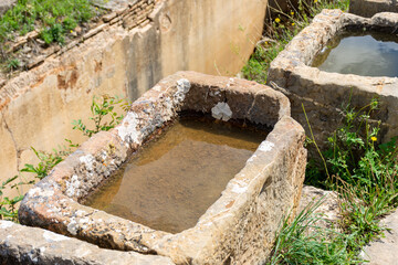 Roman water basins in the ancient town of Cuicul. UNESCO world heritage site. Djemila, Setif,...