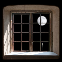 raditional wooden window frame seen from inside, moon on dark sky outside.