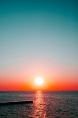 Red blue sunset on the sea, sun and water seascape