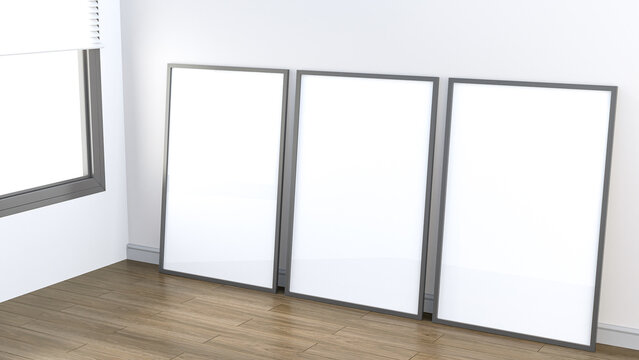 3 Framed, large blank white posters against a white wall. on the dark parquet floor by the apartment window Inside the room is decorated with luxury. 3D rendering