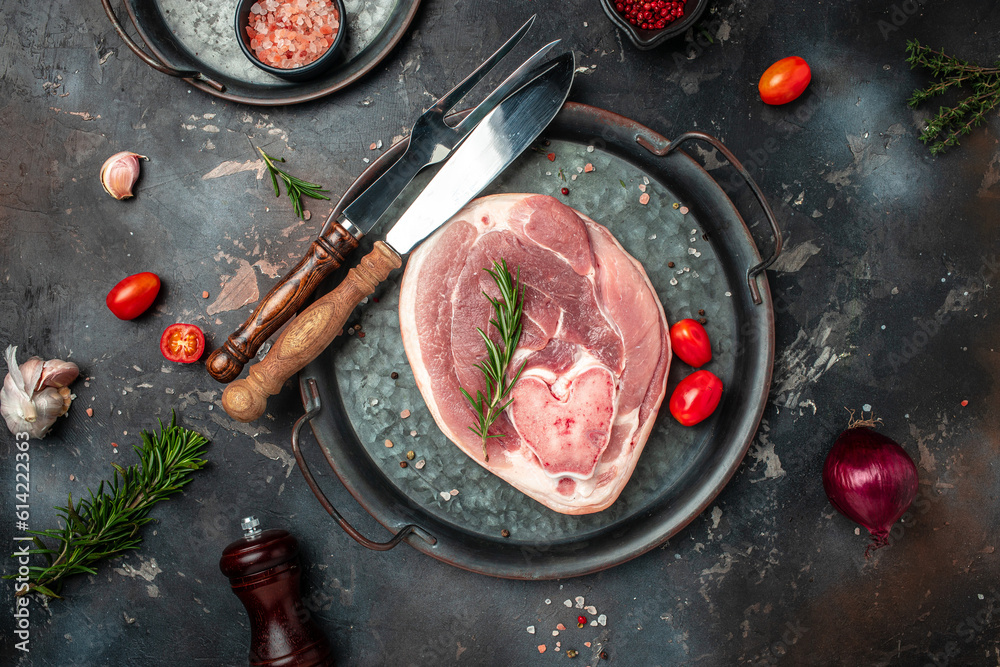 Wall mural pork meat on a wooden board, food recipe background. close up