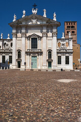 Baroque facade of the historic Cathedral of Saint Peter in the city of Mantua, Italy
