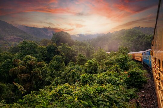 View from Indian train to unique and amazed nature scenic landscape of rain forest near Dudhsagar Falls. Goa, India. Tourism beautiful destination place.  Discover India. Open world after covid-19