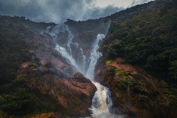 Unique and amazed nature scenic landscape of  Dudhsagar Falls in rain forest. Sonaulim, Goa, India. Tourism beautiful destination place.  Discover the beauty of earth. Open world after covid-19 - 614228576