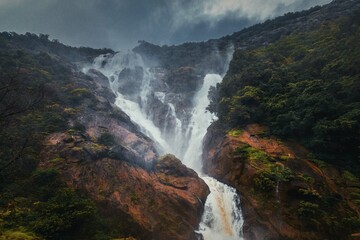 Unique and amazed nature scenic landscape of  Dudhsagar Falls in rain forest. Sonaulim, Goa, India. Tourism beautiful destination place.  Discover the beauty of earth. Open world after covid-19 - 614228584