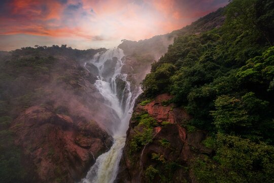 Unique and amazed nature scenic landscape of  Dudhsagar Falls in rain forest. Sonaulim, Goa, India. Tourism beautiful destination place.  Discover the beauty of earth. Open world after covid-19