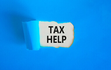 Tax help symbol. Concept words Tax help on beautiful white paper on a beautiful blue background. Business, support and tax help concept. Copy space.