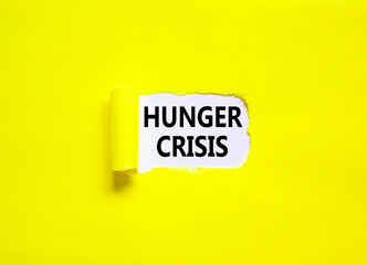 Hunger crisis symbol. Concept words Hunger crisis on beautiful white paper on a beautiful yellow background. Business, support and Hunger crisis concept. Copy space.