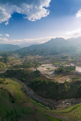 Fototapeta premium The pouring water season makes the terraced fields of Y Ty commune, Lao Cai province, Vietnam appear with brown soil blending with the beautiful sky.