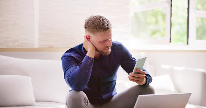 Man With Neck Pain Sitting