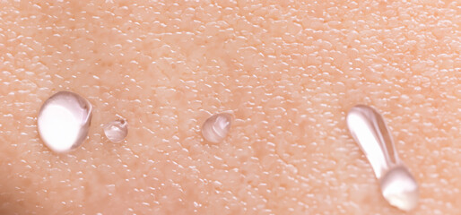 Fototapeta premium Collagen And Hyaluron Serum Gel On Skin. Splashing of Hyaluron gel. Liquid hyaluronic acid gel on skin. Cosmetic water gel texture on human skin background. Textured background. skin care product.