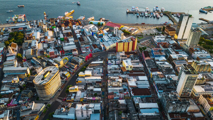 Manaus, Brazil. Aerial drone flight above city at sunset.