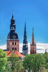 View of row of towers and spires in Riga, Latvia. Copy space in clear sky.