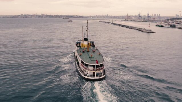 boat leaving port in Kadikoy to cross Bosphorus for Besiktas, drone footage, oe01