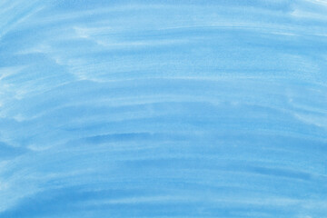 Abstract blue watercolor background. The color splashing on the paper. Hand drawn.