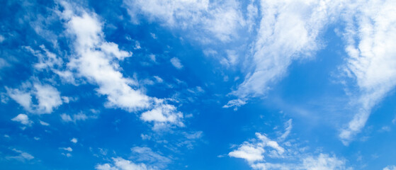 Blue sky with beautiful white clouds. Wide photo.