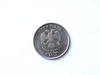 the reverse of a 2013 Russian one ruble coin that has been in circulation and has small scuffs and...