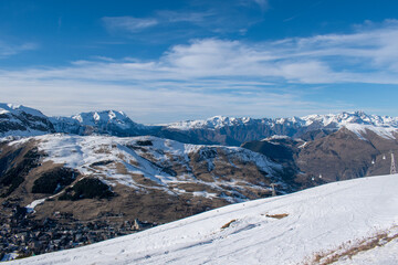 Fototapeta na wymiar Ski resort on snow covered mountains, bare mountains due to heavy melting, Les Deux Alpes, Isère, Auvergne-Rhône-Alpes, France, January 2023 (2/3)