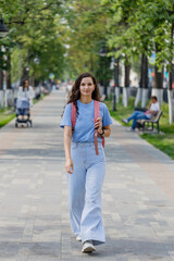 Portrait of a beautiful brunette girl outdoors on city street