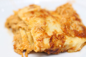 piece of chicken lasagna ready to be served. lasagna with selective focus. pasta with chicken.