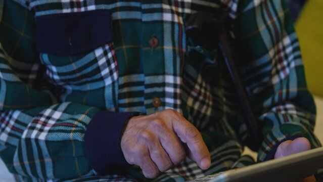 the concept of savings, the calculation of expenses and income in old age. a pensioner considers expenses on a calculator. bankruptcy, insurance payments, pensioner dividends