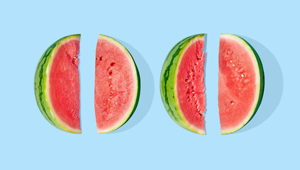 Cut watermelon on blue pastel background