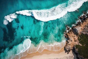 aerial view of the beach and waves. The background is a turquoise sea as seen from above. aerial picture of a seascape in the summer. aerial image taken from above. Idea and plan for a trip