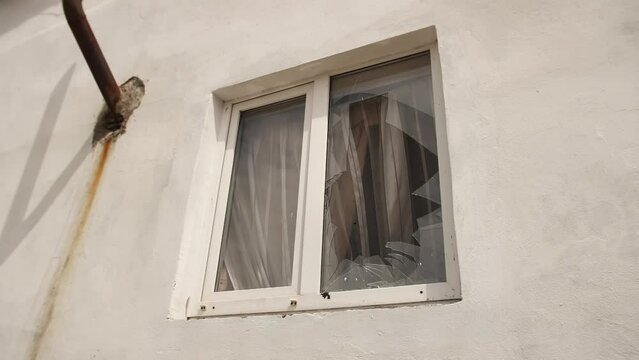 View broken window.Crash glass broken window house destroy building window crack