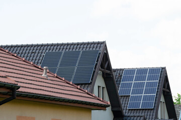 Fototapeta premium Installing a Solar Cell on a Roof.