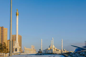 Fototapeta na wymiar Panoramic view of snow-white modern Hazaret Sultan mosque sunny morning, Nur-Sultan, Astana, Kazakhstan. . High quality photo