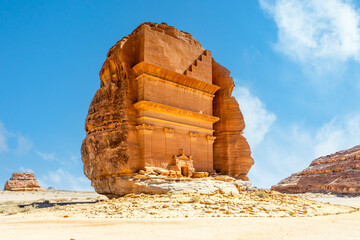 Entrance to the ancient nabataean Tomb of Lihyan, son of Kuza carved in rock in the desert, ...