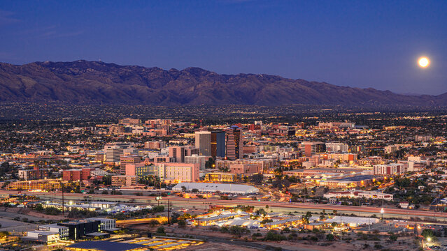 The moon rising over Tucson, Arizona as seen from "A" Mountain