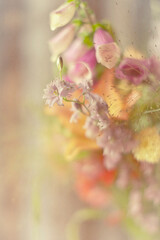 A pastel bouquet of flowers in limited focus. 