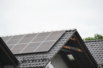 Fototapeta premium Installing a Solar Cell on a Roof.