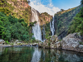 Fototapeta na wymiar Lisbon Falls and its reflection on the Lisbon River with blue sky white clouds, Panorama Route, Mpumalanga, South Africa