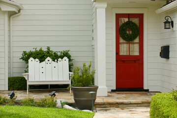 Traditional white house with bright red front door