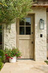 Fototapeta na wymiar limestone cottage with sun bleached wood front door