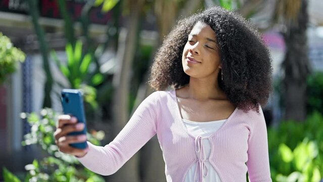 African american woman smiling confident making selfie by the smartphone at park