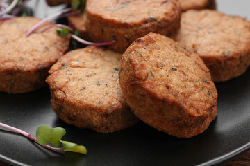 Delicious vegan cutlets on plate, closeup view