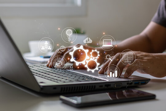 Automation Software Technology Process System Business Concept. Businessman using a computer analysis for process and workflow operations relating to the Internet of Things and automation innovation.
