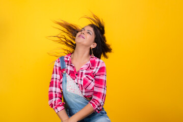 Portrait of beautiful seated woman dressed in character for Sao Joao party. Studio photo.
