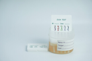 Examination of narcotic content in urine by placing the urine in a urine container and then...