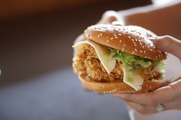 hand holding a hamburger