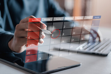 Time management concept. Businessman manages time for effective work. Calendar on the virtual...