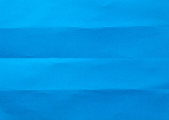 Folded blue paper for background.	