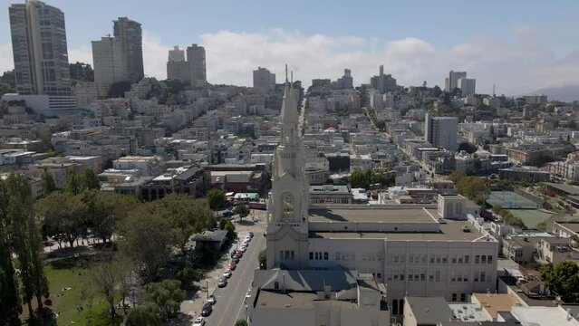 Stunning drone footage circles the historic Saints Peter and Paul Church in San Francisco's Little Italy, offering glimpses of Washington Square, the Transamerica Pyramid, and the downtown skyline.