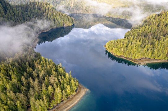 Aerial of G̱awG̱a IinaG̱waay Crescent Inlet, Haida Gwaii, BC, Canada  in early morning light
